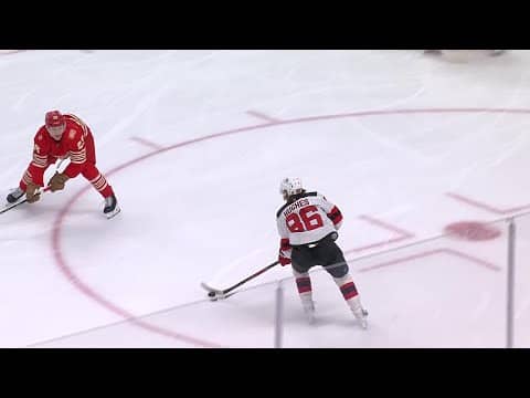 Jack Hughes scores a goal against the Detroit Red Wings
