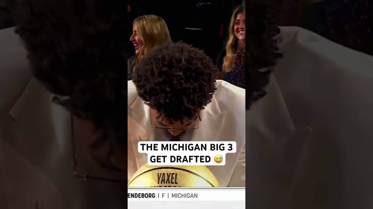 Michigan teammates celebrate with each other after getting drafted