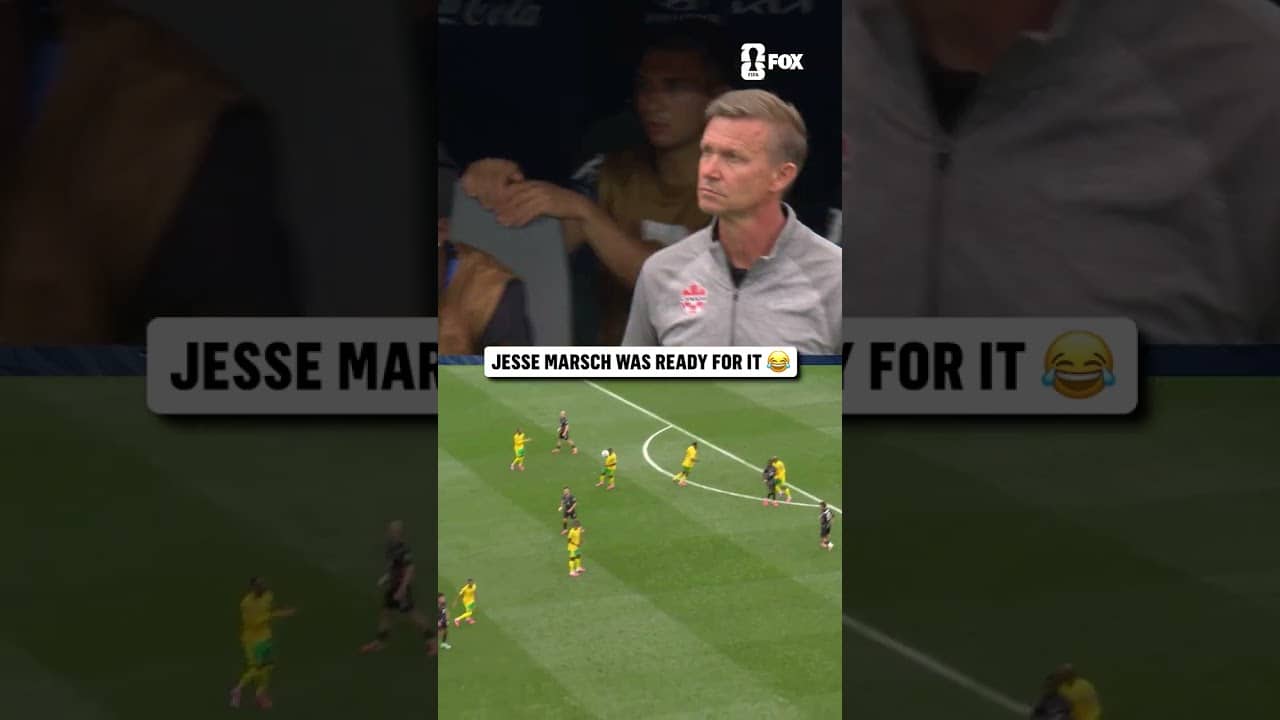 Canada's manager showing off some American football skills