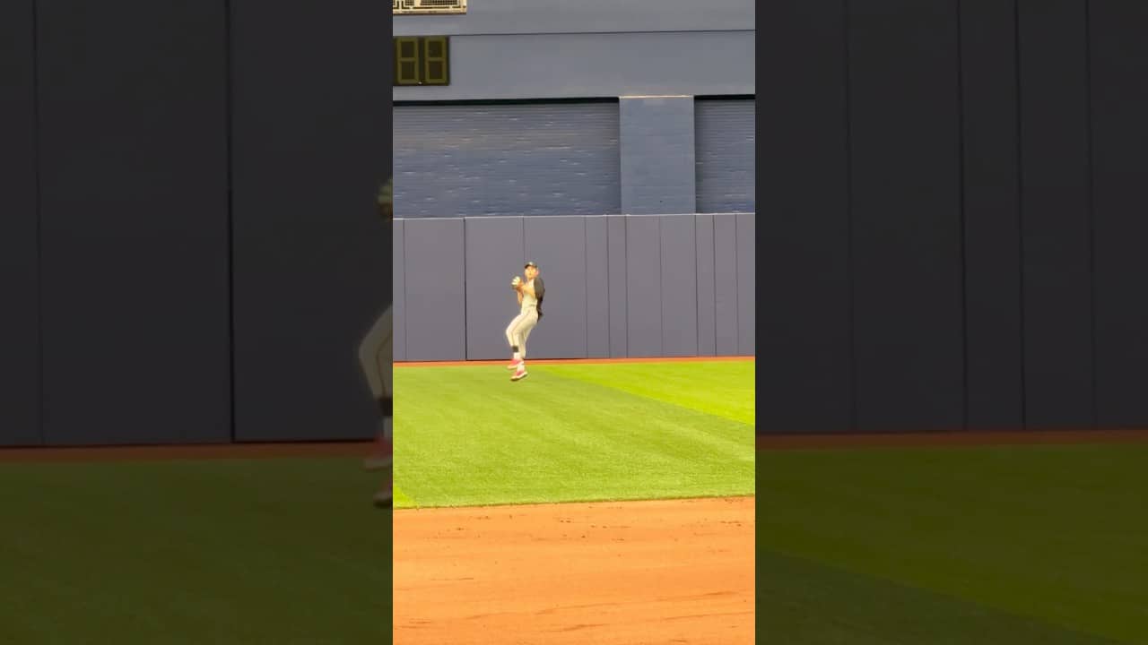 Jung Hoo Lee practices reading fly balls at Tropicana Field