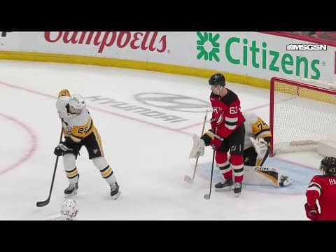 Jack Hughes scores a goal against the Pittsburgh Penguins