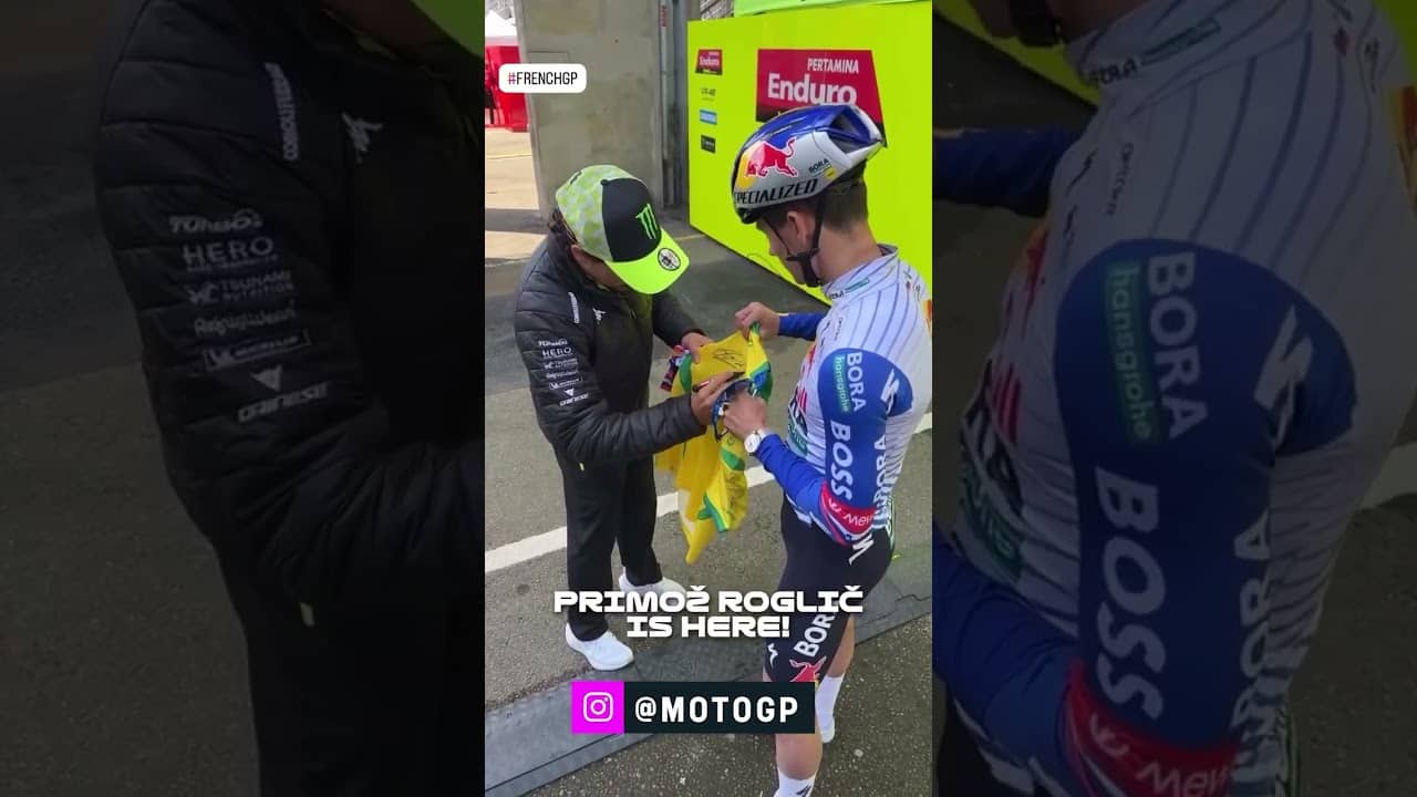The fastest men on two wheels - engines optional! 🚴‍♂️🏍️ Primoz Roglic spotted at the MotoGP  🇫🇷