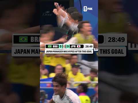 Japan manager Hajime Moriyasu celebrates his team taking the lead over Brazil in the Round of 32