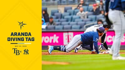 Jonathan Aranda dives to make the tag vs the New York Yankees