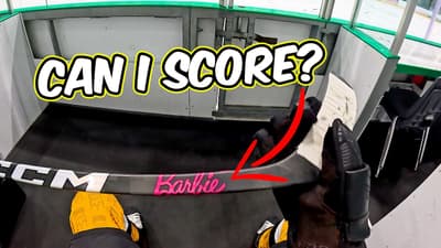Trying to Score with a Barbie Hockey Stick
