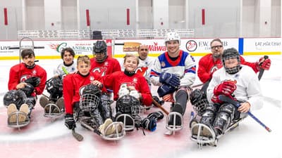Jack Wallace, Devils and Prudential donate 100 new helmets and 10 new sleds