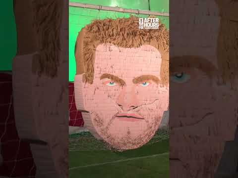 Javier Hernández takes a swing at a piñata that looks... vaguely familiar